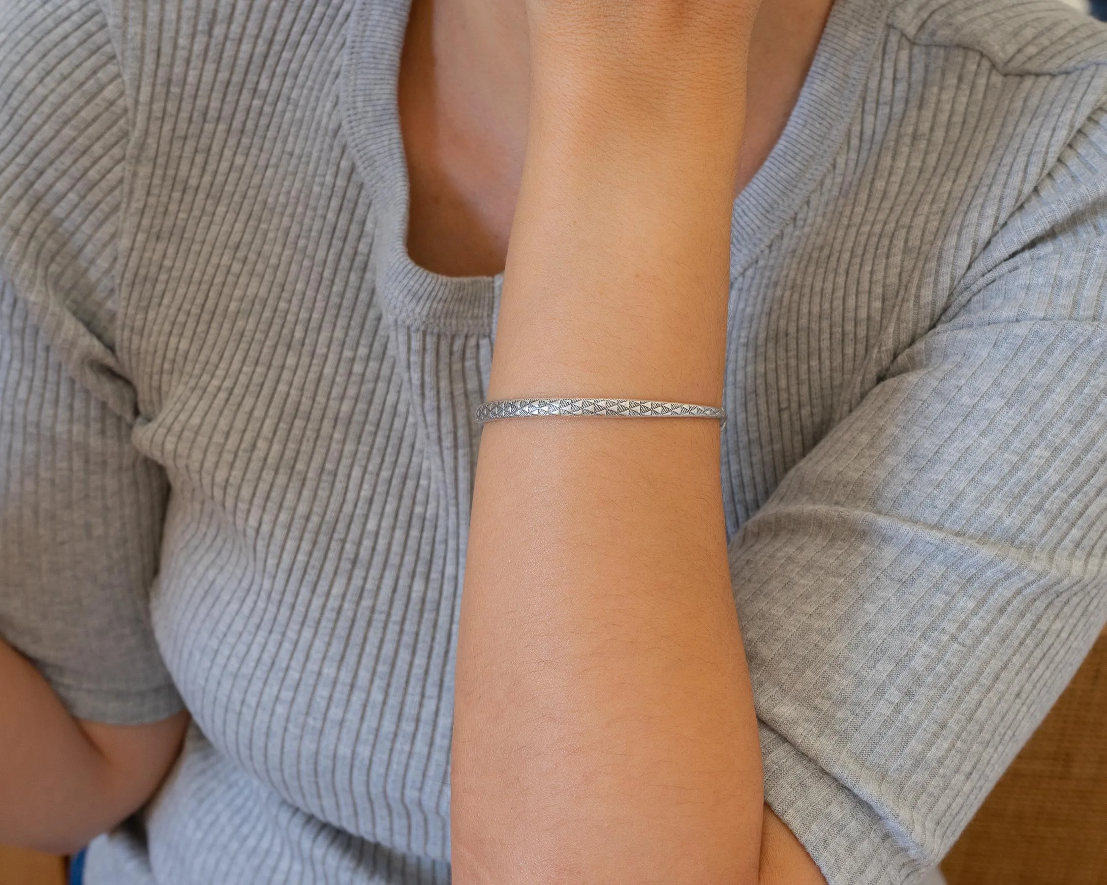 Silver Hammered Bangle with Floral Pattern