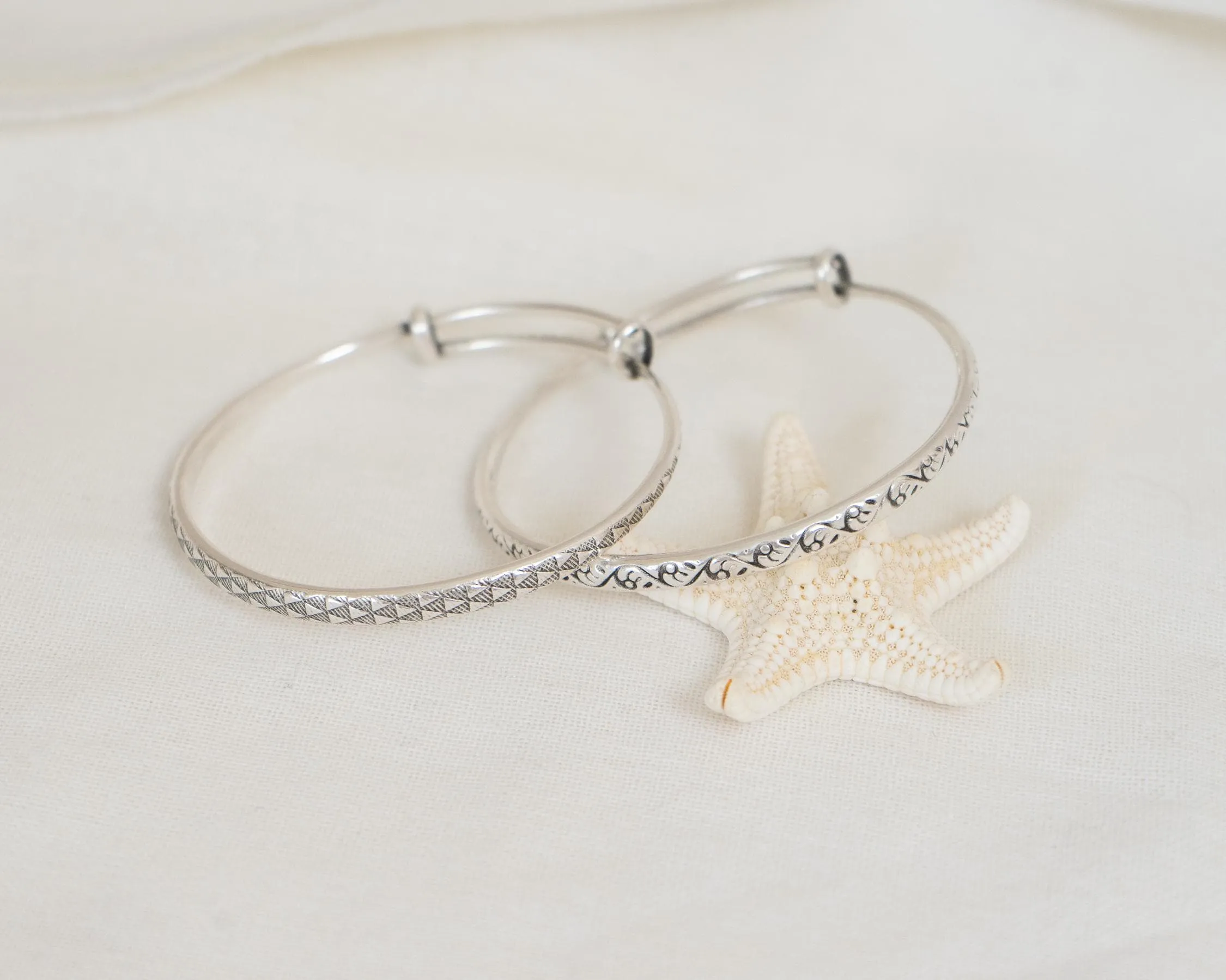 Silver Hammered Bangle with Floral Pattern